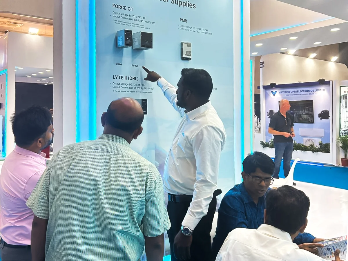 Sales present power supply to visitor in delta's booth