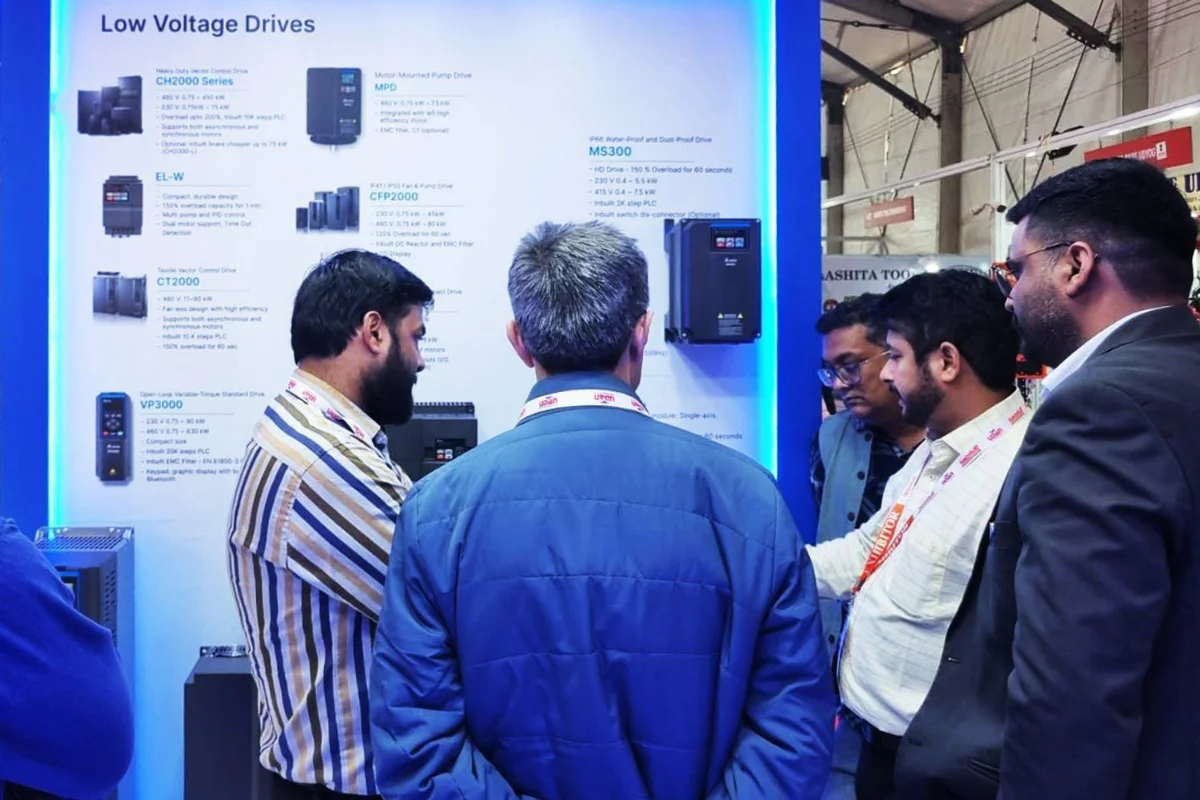 Delta sale introduces the automation product to visitor in Delta booth